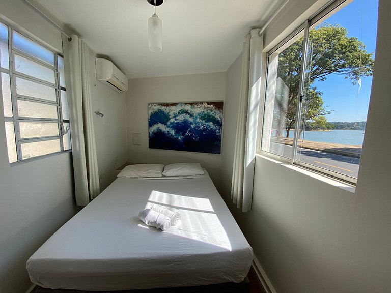 En-suite room in Pampulha with lake views and a pool